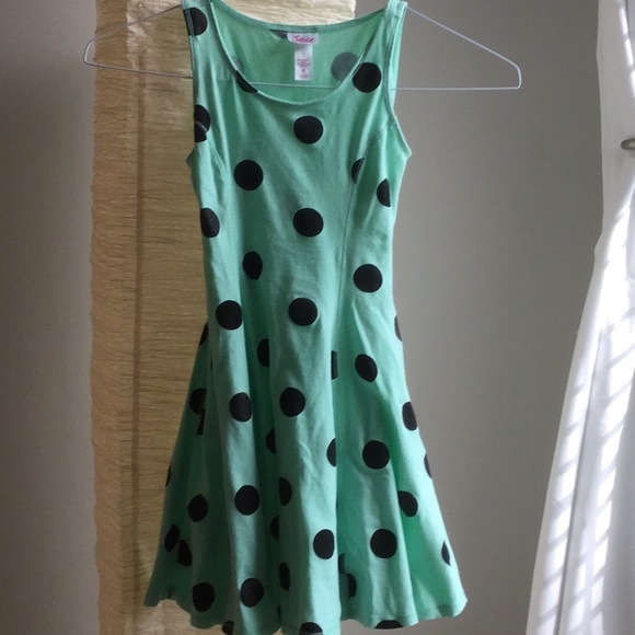 green dress with black polka dots